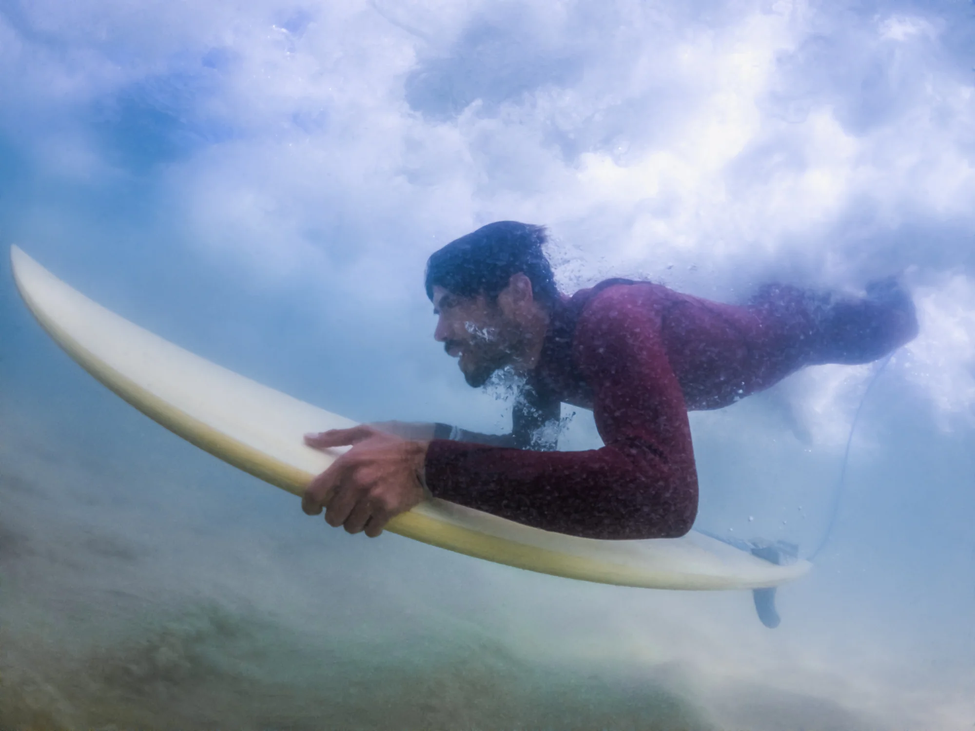 Surfer duck diving